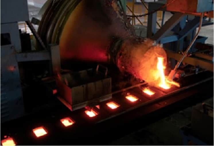 Pouring metal into a mold